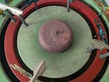 a green and red object with a red center