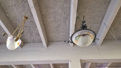 two lamps hanging from the ceiling of a room