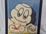 photo encadrée représentant un personnage de dessin animé avec un vélo