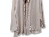 shirt on a hanger on a white wall with a black tie