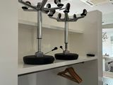 an image of a room with a coat rack and a mirror