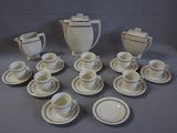 a lot of cups and saucers on the table
