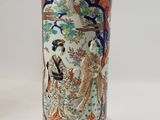 a vase with a picture of a woman and a bird on it