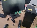 a desktop computer sitting on a desk next to a keyboard and mouse