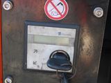 a close up of a parking meter with a key in it