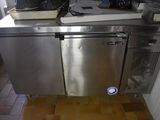 a stainless steel dishwasher sitting on top of a counter
