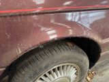 a close up of a car that has a tire on it