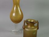 two vases sitting next to each other on a table