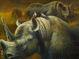 a painting of a rhino and a bird on top of it