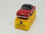 a red toy car sitting on top of a yellow box