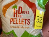 a bag of pellets sitting on a shelf in a store