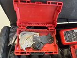a tool in a red case with wires and wires in it