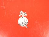 a close up of a red box with a sticker on it