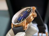 a watch that is being held up by a glove