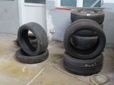 four tires stacked on top of each other in a garage