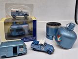 a blue toy truck and other toy vehicles on a table