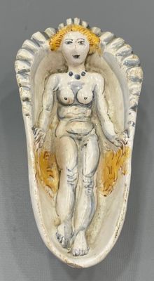 an image of a statue of a woman in a shell