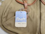 a brown bag with a tag attached to it