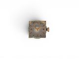 a small metal clock that is sitting on a white surface