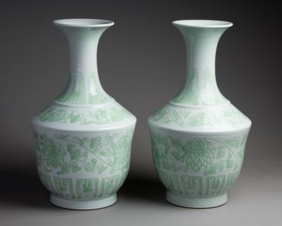 two vases sitting side by side on a table