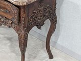 a marble top table with a drawer underneath it