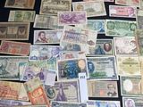 many different types of paper money on the table