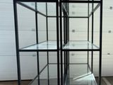 a glass display case on a pallet in a warehouse