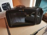 a camera that is sitting on top of a box