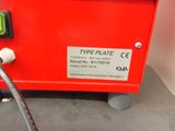 an image of a type plate machine with a hose attached to it