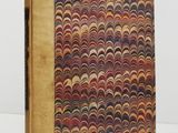 a book with a pattern on it sitting on top of a table