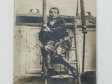 a black and white photo of a man sitting in a chair