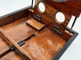 a wooden box with a mirror on top of it
