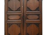 a pair of antique wooden doors with ornate carvings
