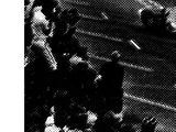 a black and white photo of a man in a boxing ring