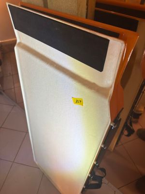 a refrigerator that is sitting in the corner of a room
