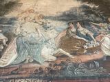 a large tapestry on the floor in a room