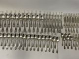 a lot of silver spoons and spoon spoons on the table