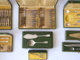 many different types of silverware in a case