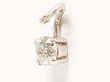 an image of a pair of diamond earrings on a white surface