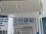 a box of toilet paper sitting on top of a toilet
