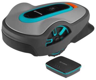 a robotic lawn mower with a remote control and a charger