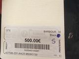 a person holding a white card with a barcode on it