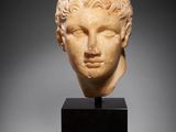 a roman marble head of a youth