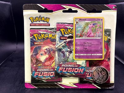 a close up of a box of pokemon cards on a table