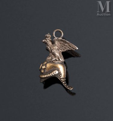 an image of a silver pendant with an eagle on top of it