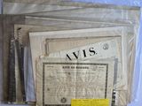 some old papers are sitting on top of a table