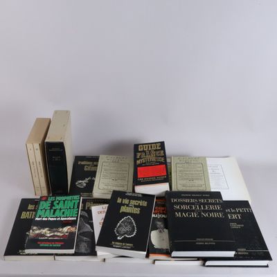 several books are stacked on a table with a white background