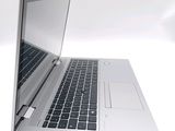 a close up of a laptop computer on a white surface