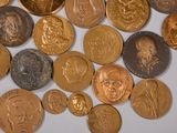 a lot of coins that are sitting on a table