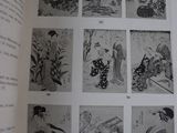a book with a picture of a woman in a kimono